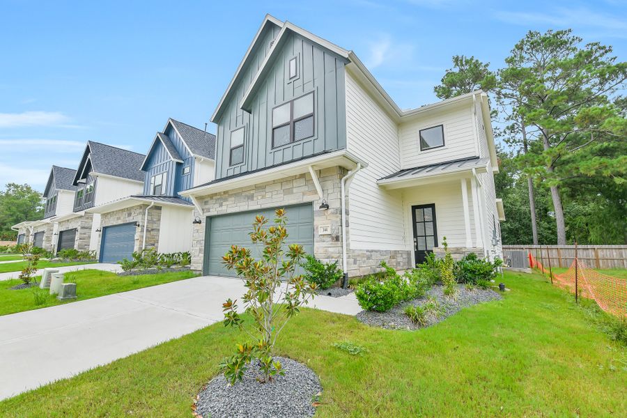 Front exterior of a new home in Summer Place  35', Montgomery, TX, highlighting curb appeal (Image 28).