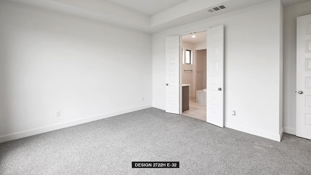 Unfurnished bedroom with carpet flooring and ensuite bathroom
