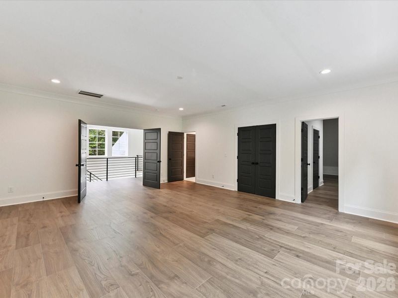 Spacious bonus room offering flexible space for a media room, playroom, home gym, or additional living area.