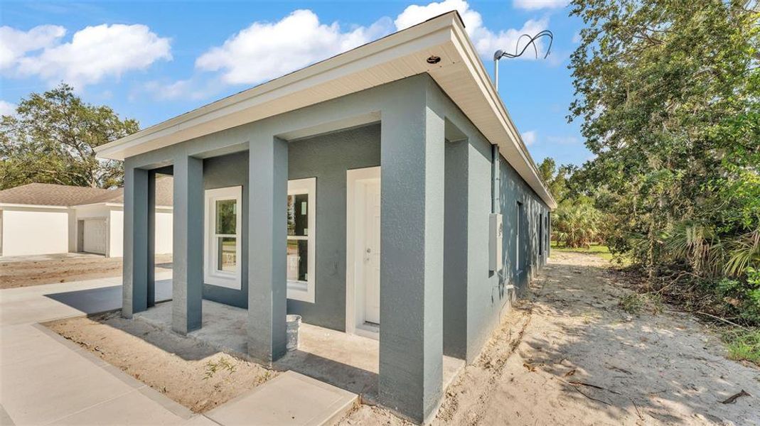 Front exterior of a new home in , Winter Haven, FL, highlighting curb appeal (Image 13).