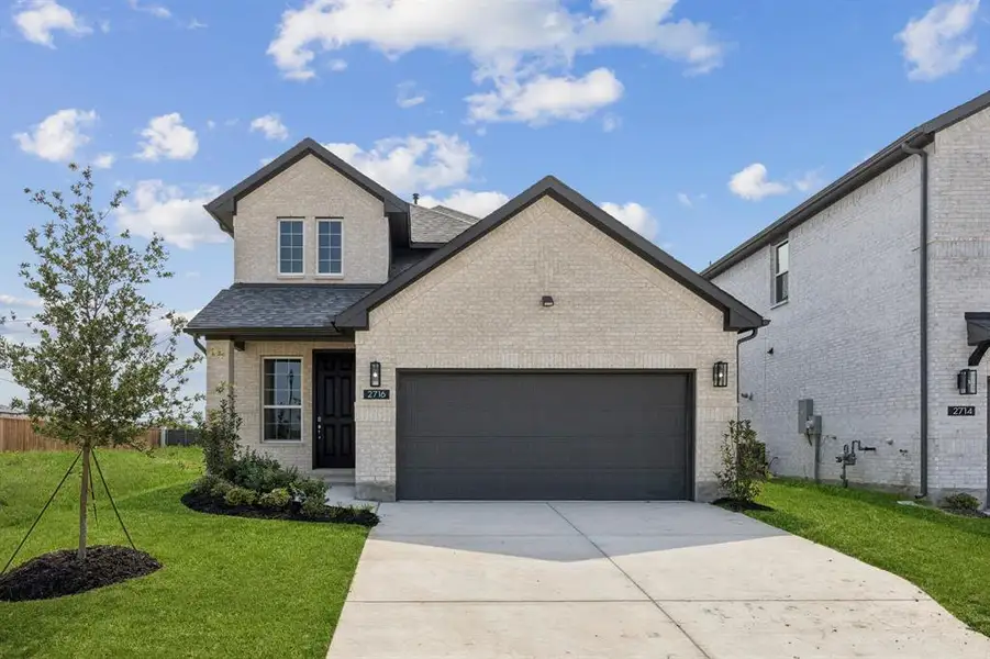 Front exterior of a new home in Bellagio, Forney, TX, highlighting curb appeal (Image 1).
