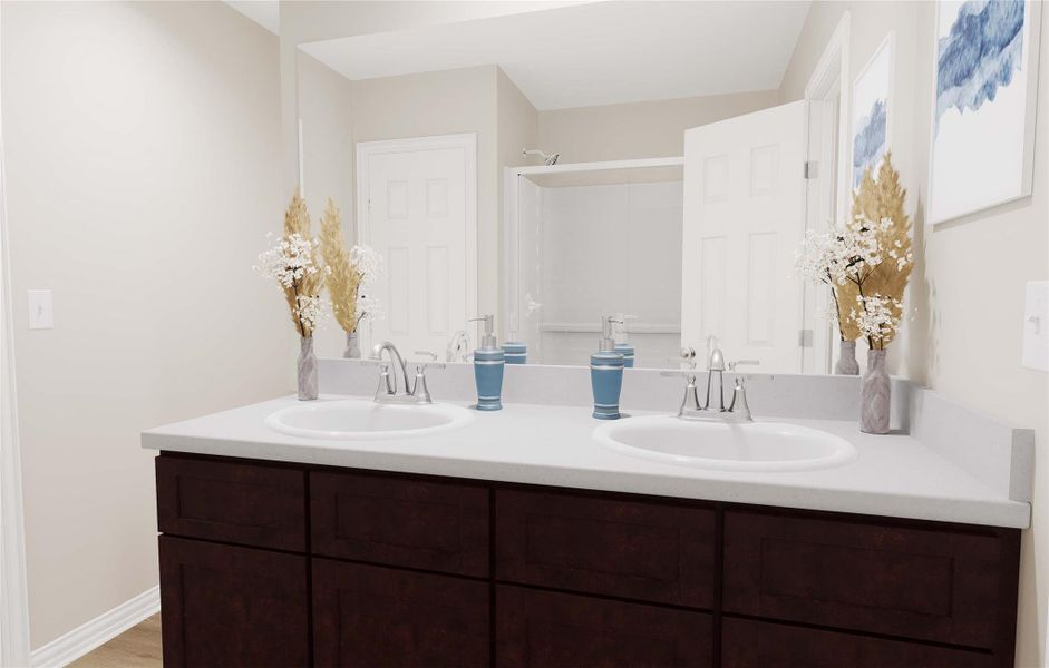 Bathroom featuring a shower, a sink, and double vanity Bathroom featuring a shower, a sink, and double vanity