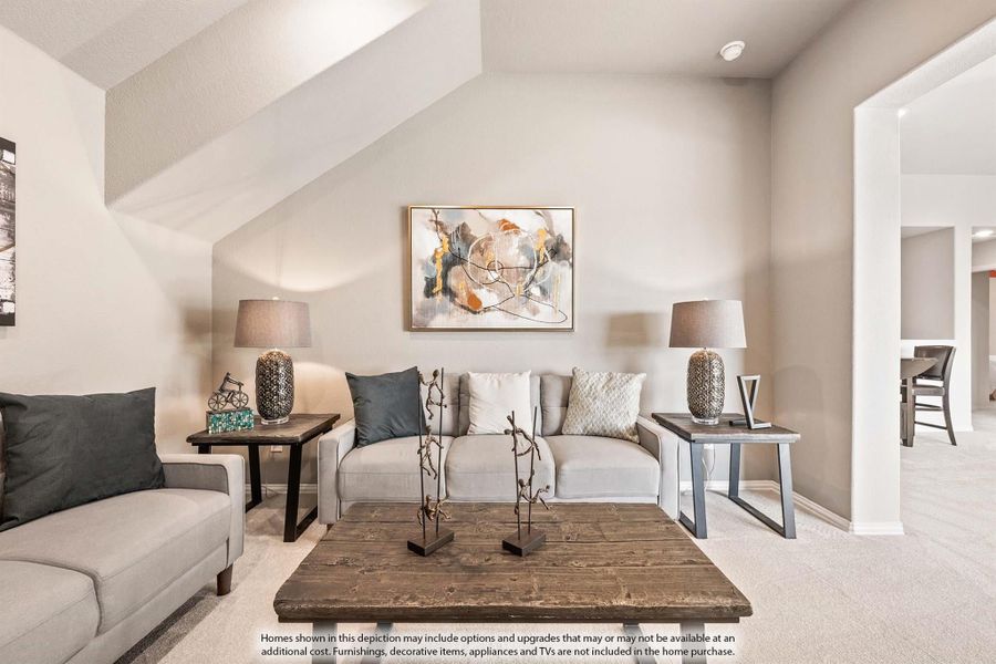 Living room with gray sofas, rustic wood coffee table, and abstract wall art on beige walls with carpet flooring