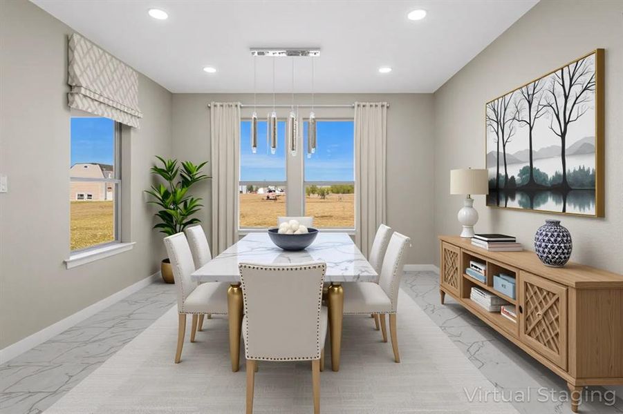 Dining room featuring light marble finish floors, recessed lighting, and plenty of natural light