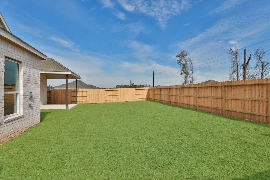 Exterior details and patio area of a home in Sundance Cove, Crosby (Image 3).