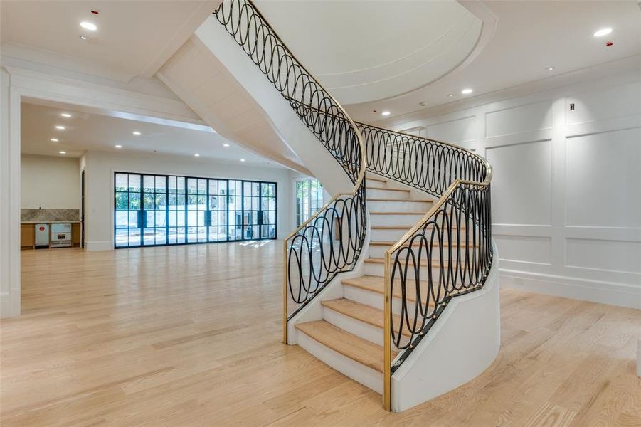 Staircase with hardwood / wood-style floors