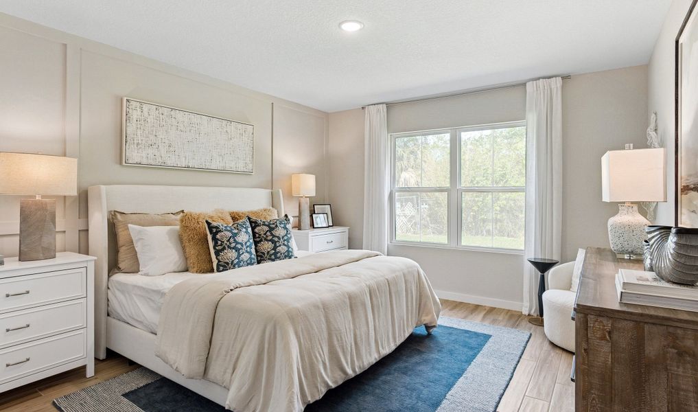 Primary suite with decorative feature wall