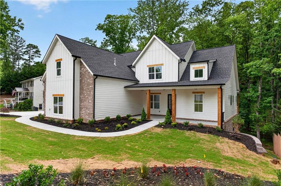 Front exterior of a new home in , Cumming, GA, highlighting curb appeal (Image 26).
