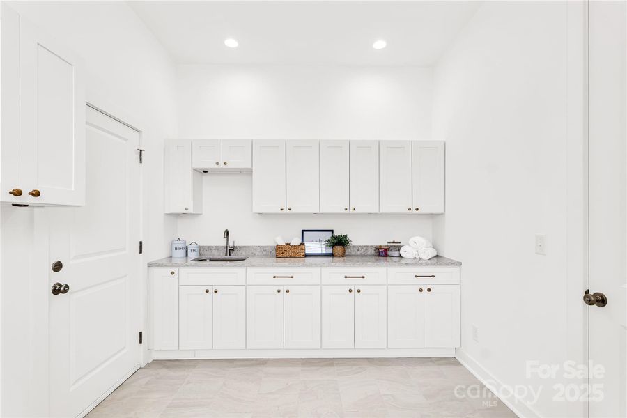 Custom designed laundry room off garage