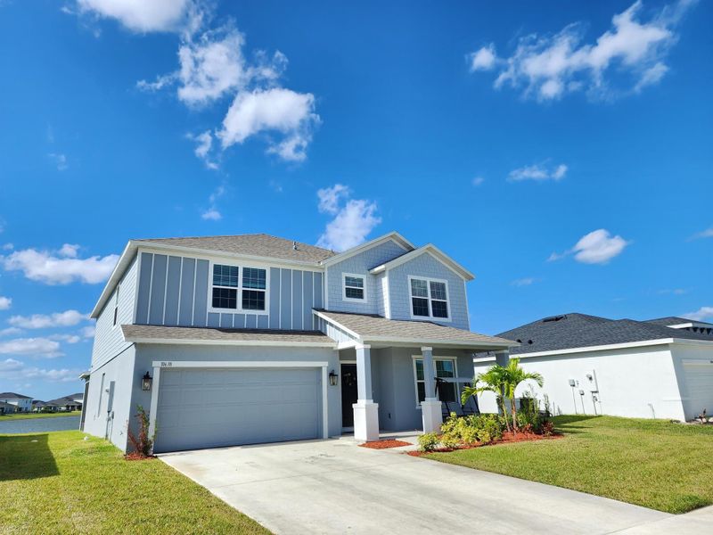 Front exterior of a new home in , Port St. Lucie, FL, highlighting curb appeal (Image 28). Front exterior of a new home in , Port St. Lucie, FL, highlighting curb appeal (Image 28).