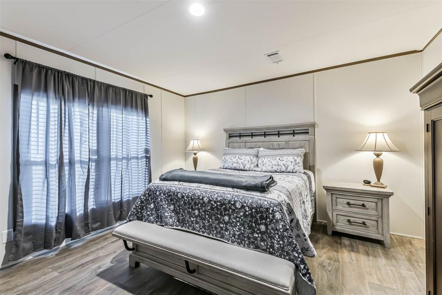 Master bedroom w/ Laminate flooring and good size closet