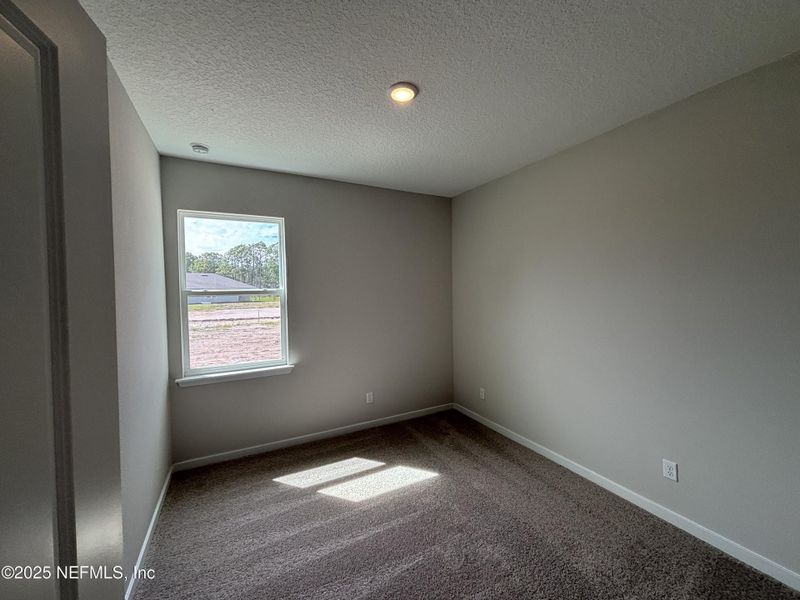 Spacious, unfurnished interior of a new home in The Magnolia Series at Reserve East, Flagler Beach (Image 10).