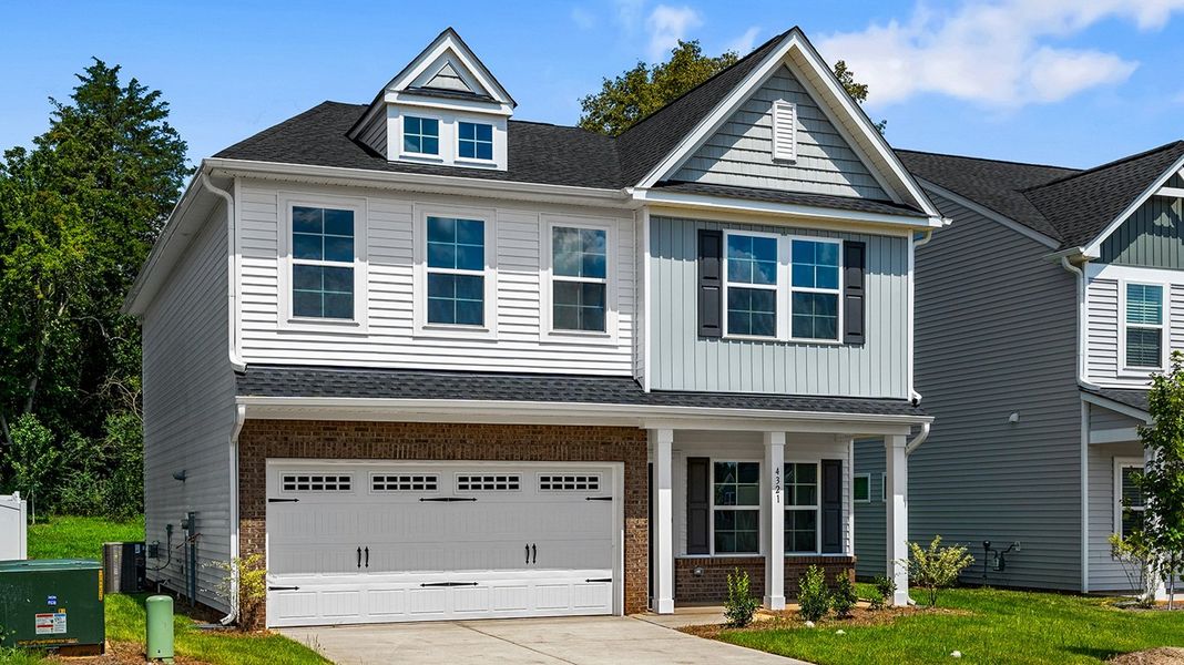 Front exterior of a new home in Hanes Lake, Winston-Salem, NC, highlighting curb appeal (Image 25). Front exterior of a new home in Hanes Lake, Winston-Salem, NC, highlighting curb appeal (Image 25).