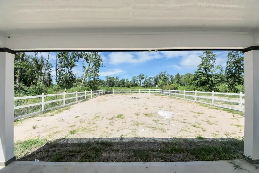 Exterior details and patio area of a home in , Splendora (Image 3).