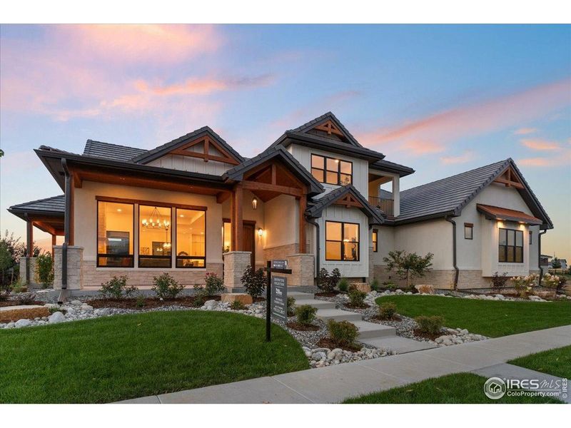 Front exterior of a new home in , Berthoud, CO, highlighting curb appeal (Image 21).