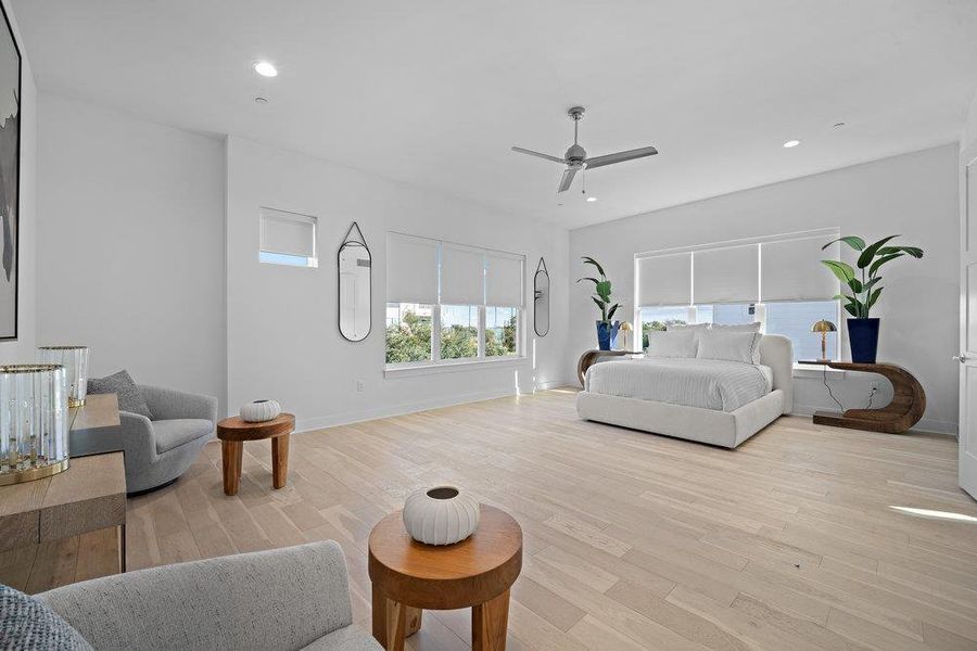Bedroom featuring light wood finished floors, recessed lighting, and ceiling fan Bedroom featuring light wood finished floors, recessed lighting, and ceiling fan