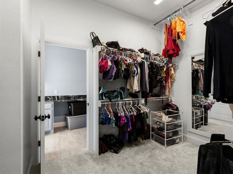 Walk in closet with light carpet Walk in closet with light carpet