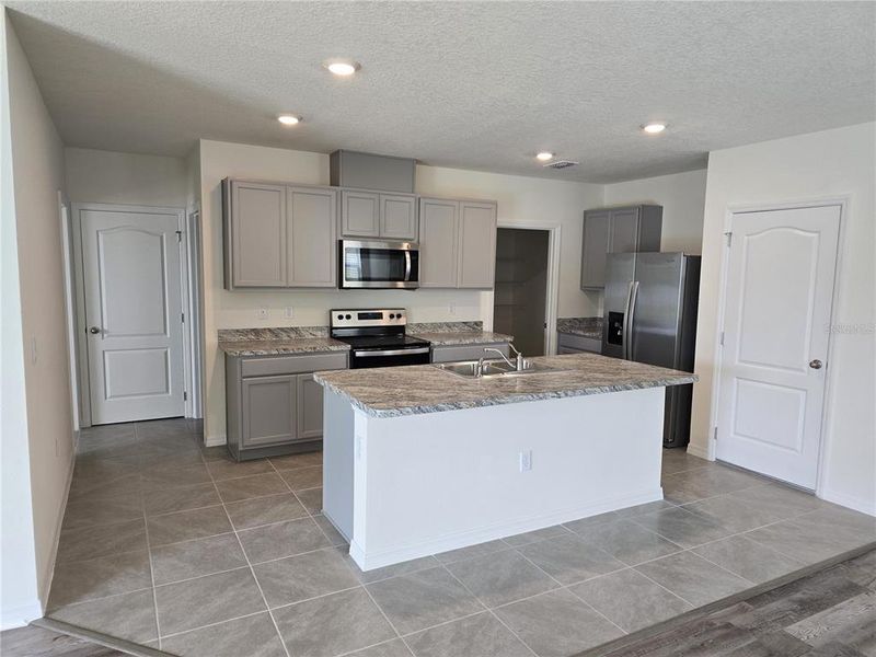 Furnished interior view inside a new home in Charles Cove Express, Davenport (Image 8).