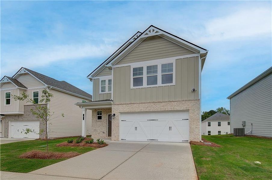Front exterior of a new home in Enclave at Evergreen, Fairburn, GA, highlighting curb appeal (Image 15). Front exterior of a new home in Enclave at Evergreen, Fairburn, GA, highlighting curb appeal (Image 15).