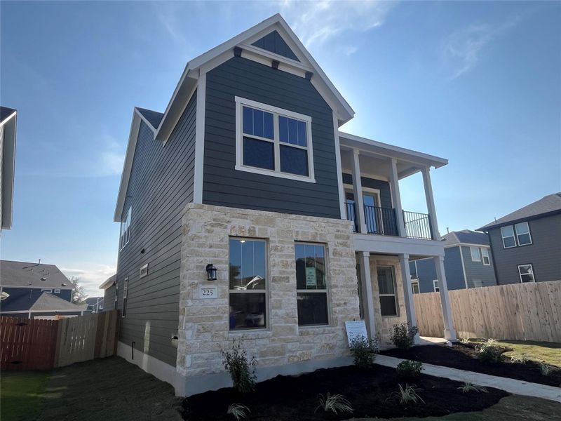 Exterior details and patio area of a home in The Cottages at Lariat, Liberty Hill (Image 21).