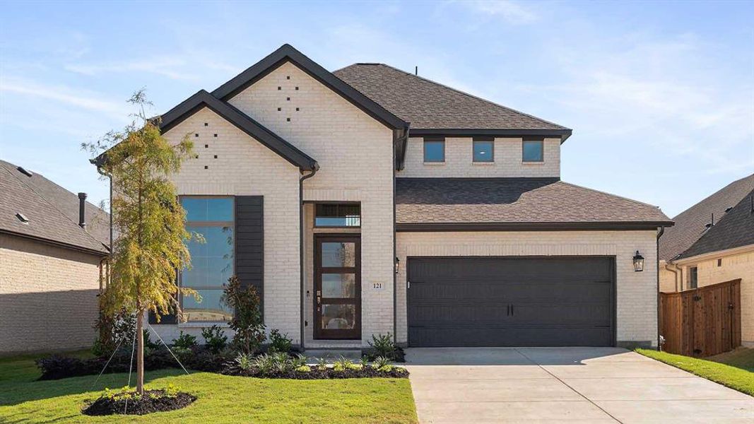 Front exterior of a new home in Trinity Falls 50', McKinney, TX, highlighting curb appeal (Image 1).