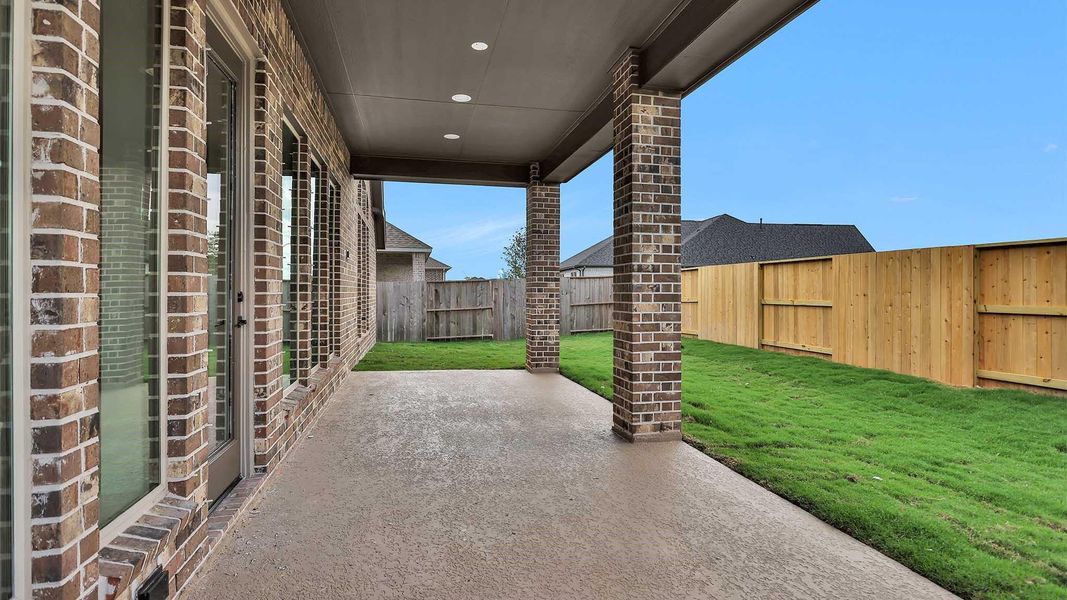 Exterior details and patio area of a home in Serenity 55+ Active Adult, Arcola (Image 3).