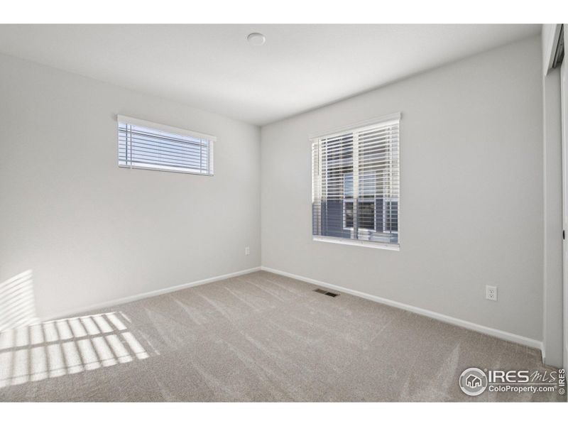 Spacious, unfurnished interior of a new home in The Villas Collection at Sterling Ranch, Littleton (Image 31).