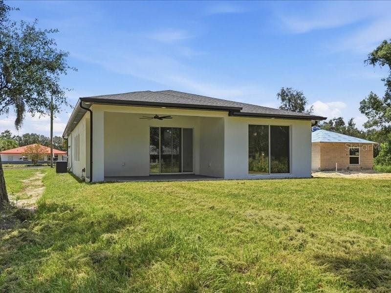 Exterior details and patio area of a home in , Winter Haven (Image 28).