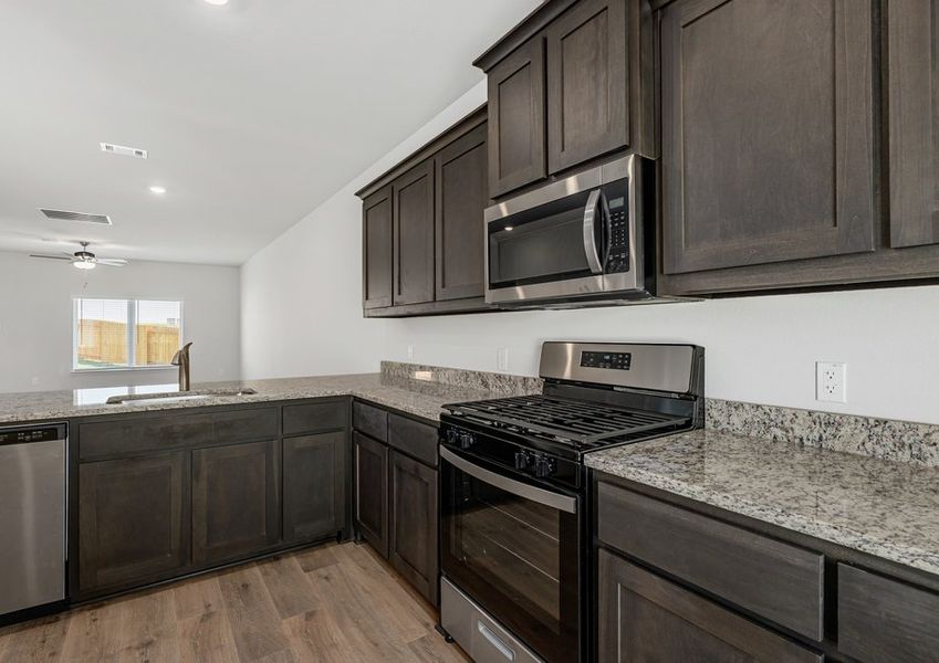 The kitchen has energy-efficient, stainless-steel appliances. The kitchen has energy-efficient, stainless-steel appliances.