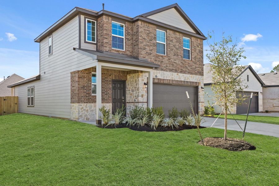 Front exterior of a new home in Lexington Heights, Willis, TX, highlighting curb appeal (Image 2). Front exterior of a new home in Lexington Heights, Willis, TX, highlighting curb appeal (Image 2).