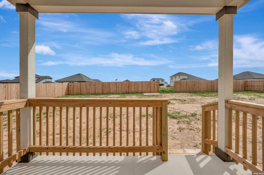 Exterior details and patio area of a home in Hickory Ridge Estates, Elmendorf (Image 3).