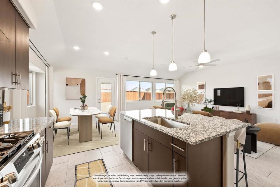 Open-concept kitchen with granite island, dark cabinets, pendant lights, and dining area in background