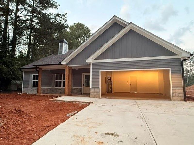 Front exterior of a new home in , Dallas, GA, highlighting curb appeal (Image 1). Front exterior of a new home in , Dallas, GA, highlighting curb appeal (Image 1).