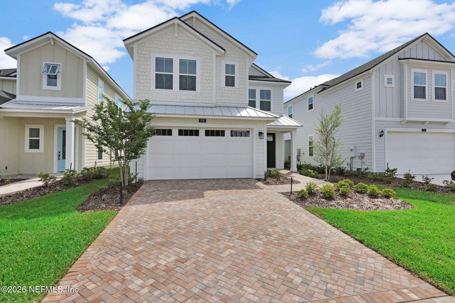 Front exterior of a new home in Seabrook Village at Seabrook, Nocatee, FL, highlighting curb appeal (Image 26).