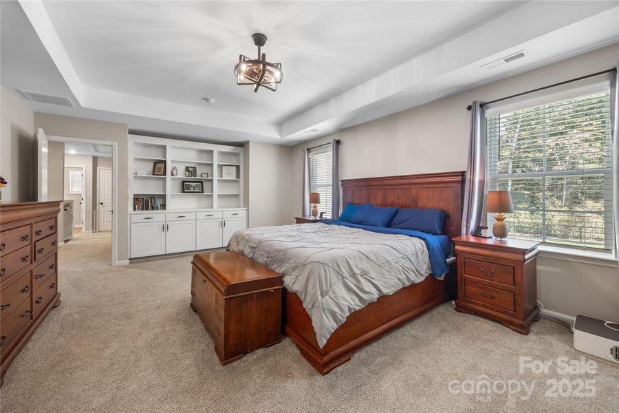 Primary bedroom with custom built-ins. Primary bedroom with custom built-ins.