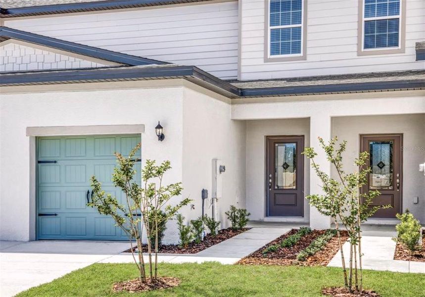 Front exterior of a new home in Sol Vista, Dundee, FL, highlighting curb appeal (Image 15).
