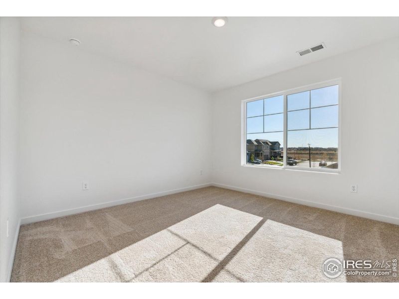 Spacious, unfurnished interior of a new home in Silver Peaks, Lochbuie (Image 22).