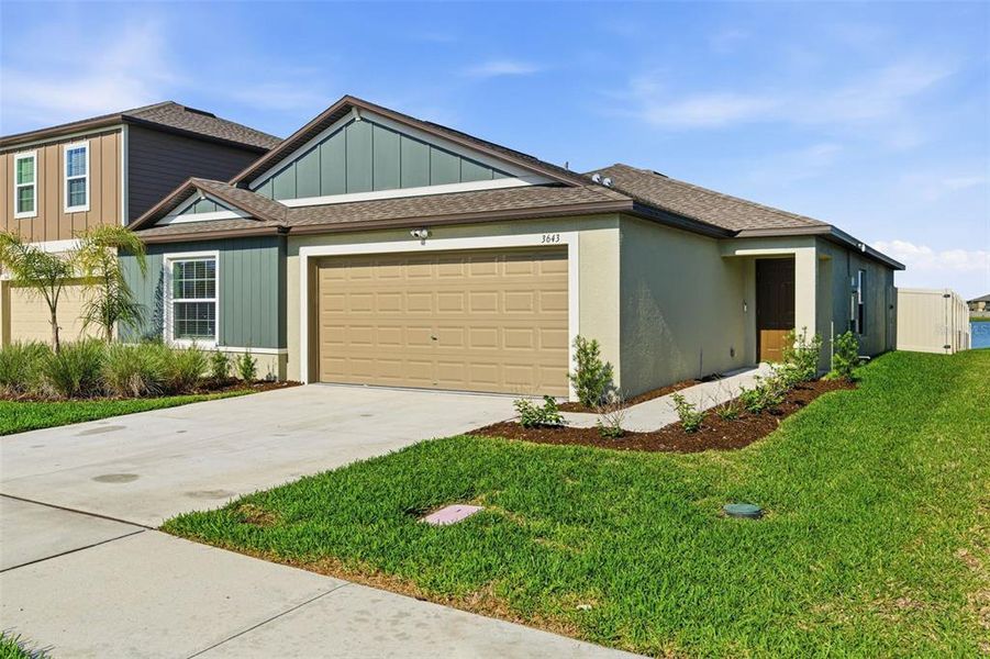 Front exterior of a new home in North Park Isle, Plant City, FL, highlighting curb appeal (Image 21).