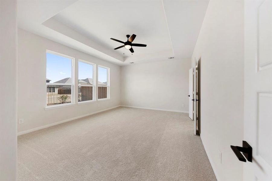 With high ceilings, oversized windows and plush carpeting, this owner's suite was designed for rest and relaxation.