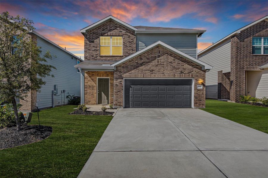 Front exterior of a new home in Chapel Run, Montgomery, TX, highlighting curb appeal (Image 1).