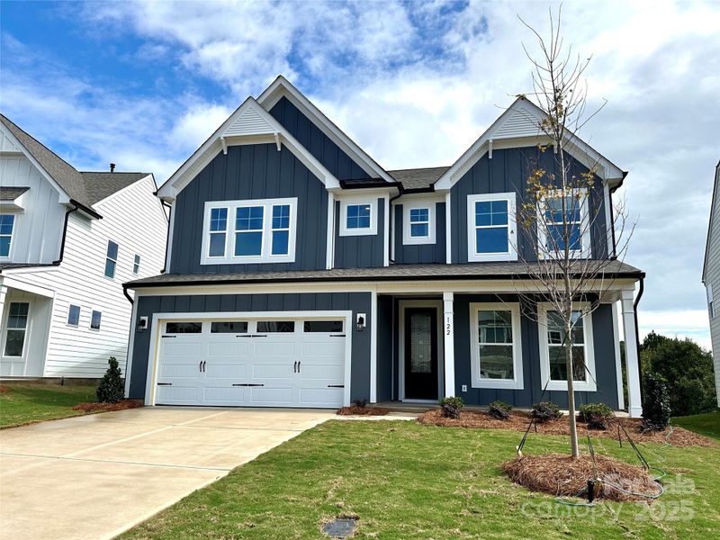 Front exterior of a new home in Summerlin, Mooresville, NC, highlighting curb appeal (Image 1).