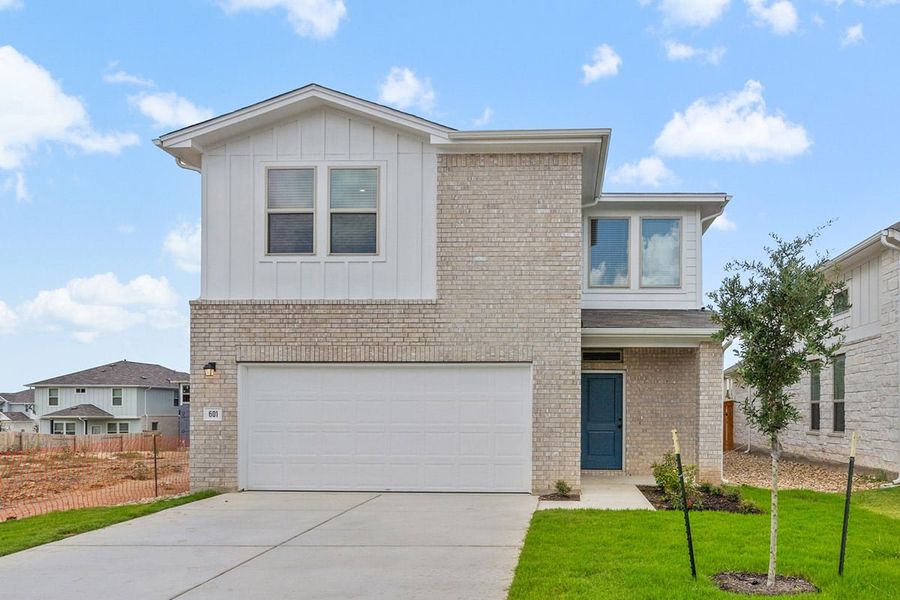 Front exterior of a new home in Crosswinds, Kyle, TX, highlighting curb appeal (Image 18).