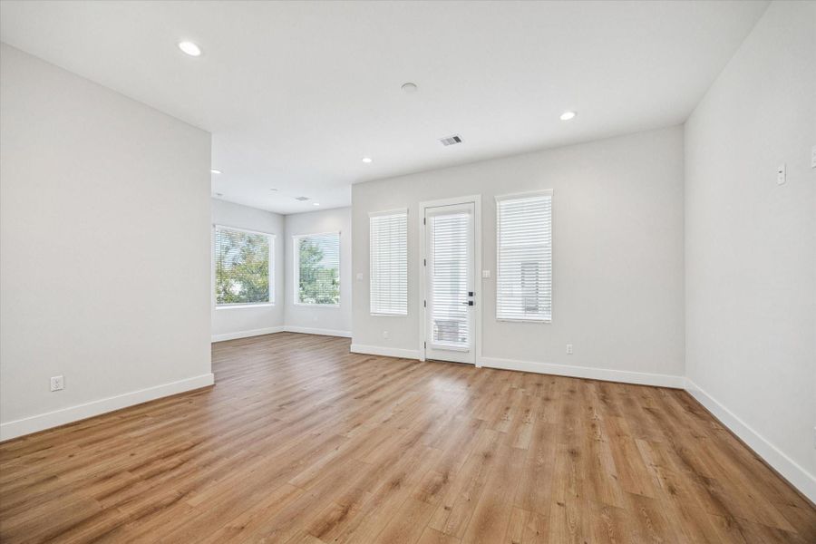 The living room has direct access to the balcony, creating a seamless indoor/ outdoor space perfect for entertaining.