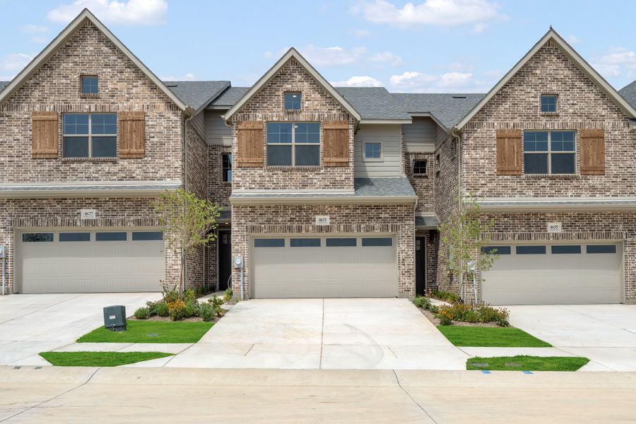 Front exterior of a new home in Wildridge, Oak Point, TX, highlighting curb appeal (Image 2). Front exterior of a new home in Wildridge, Oak Point, TX, highlighting curb appeal (Image 2).