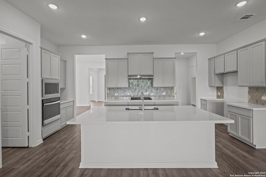 Furnished interior view inside a new home in Homestead 65', Schertz (Image 7).