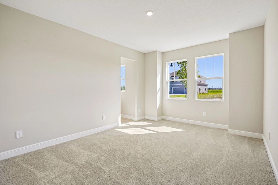 Off the foyer is bedroom 3 located at the front of the home with double windows