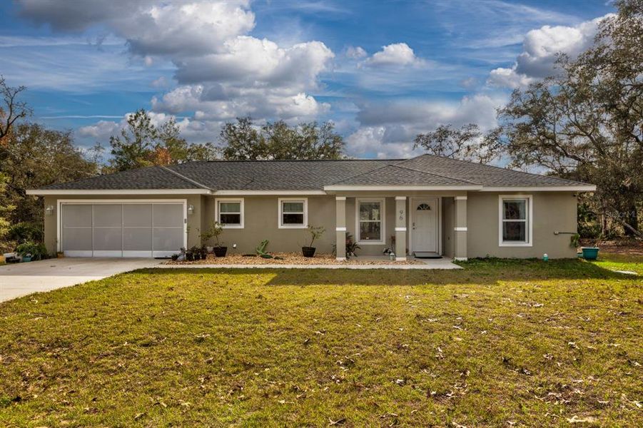 Front exterior of a new home in , Ocklawaha, FL, highlighting curb appeal (Image 21).