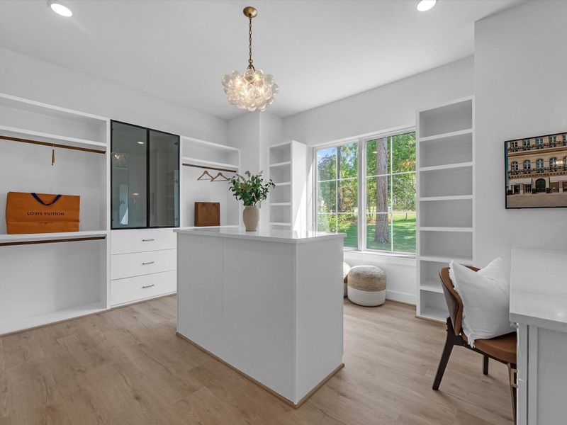 The larger of the two closets with a built in vanity