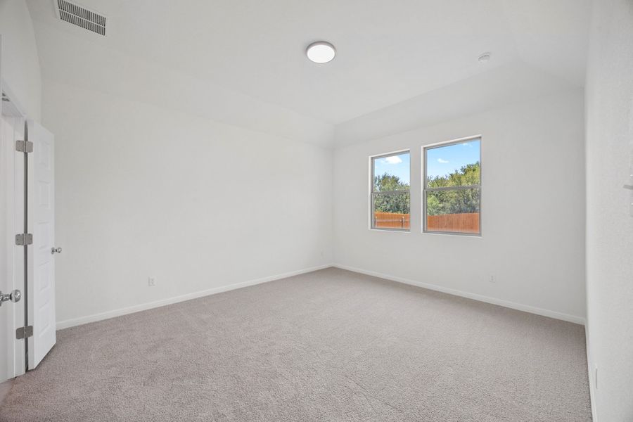 Primary Suite in the Elm home plan by Trophy Signature Homes – REPRESENTATIVE PHOTO