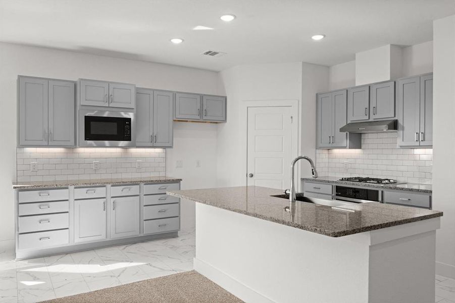 Kitchen with island breakfast bar, granite countertops, tile backsplash and gray cabinetry